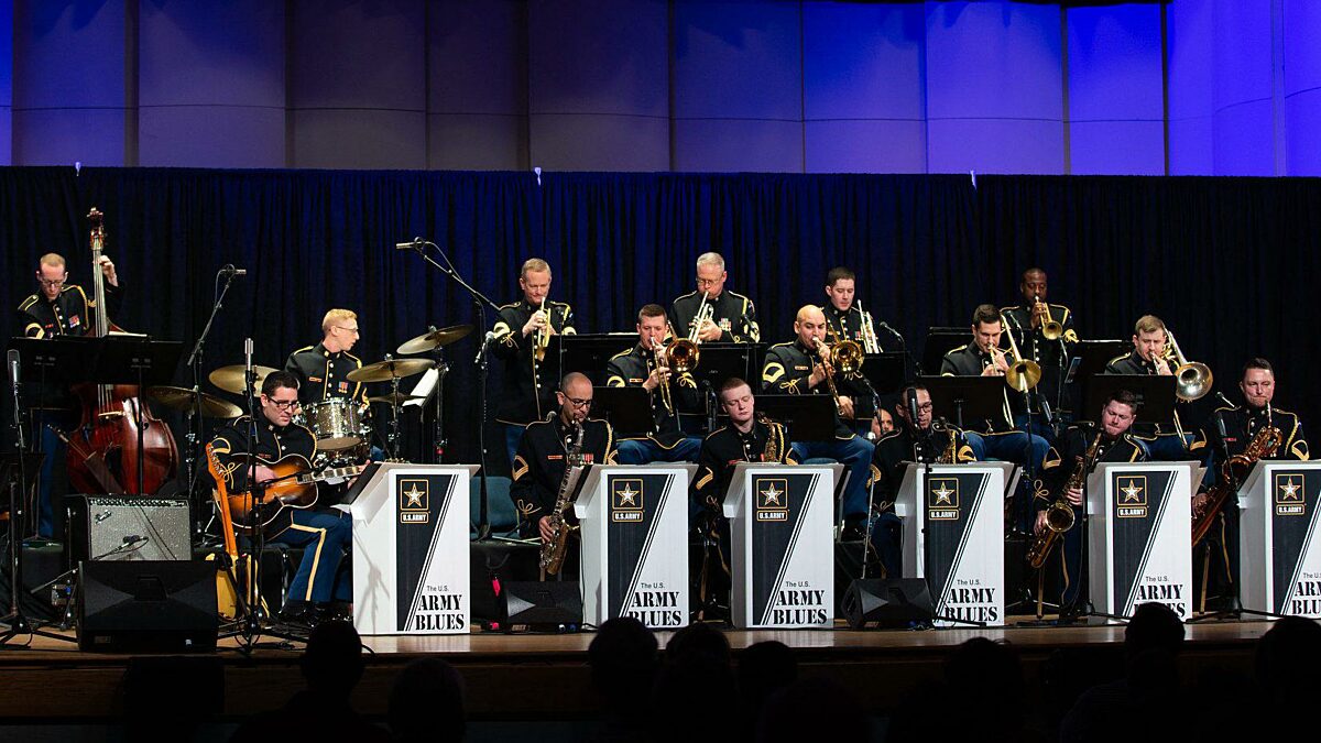 A wide shot of the US Army Blues showing the entire group during a performance.